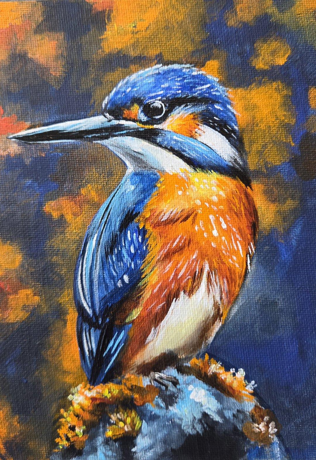 Acrylic painting of a kingfisher perched on a mossy rock, its bright blue and orange feathers set against a blurred blue and amber background.